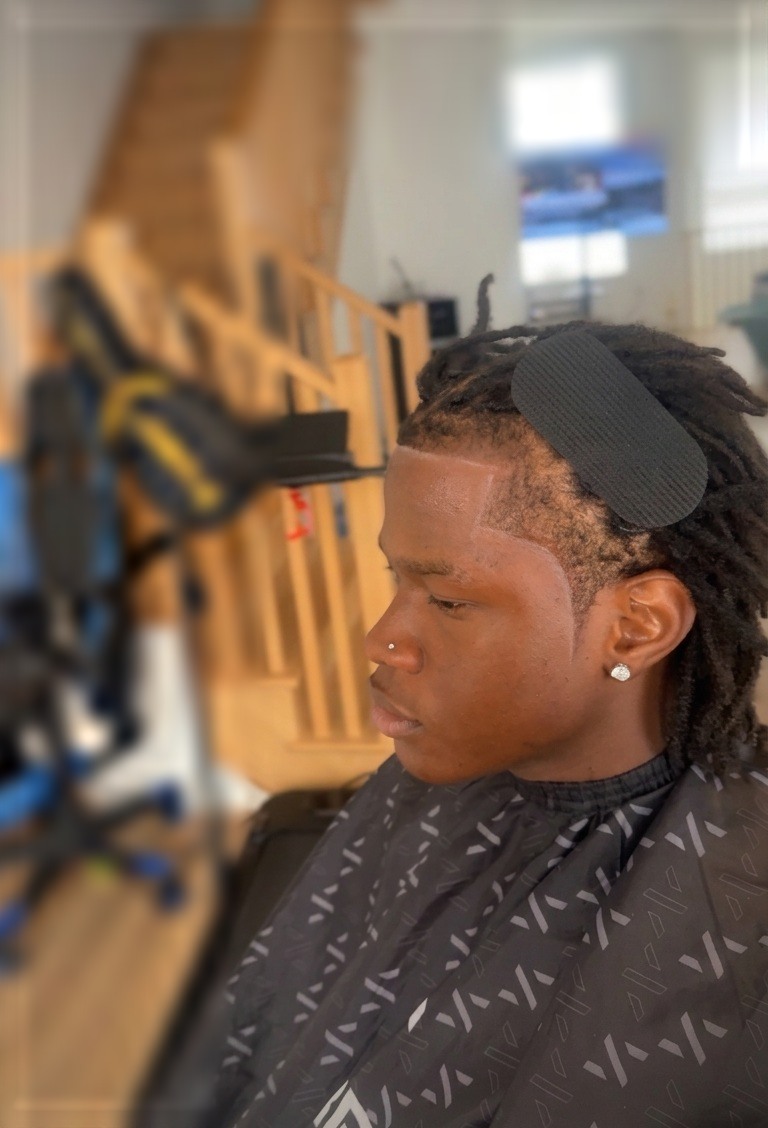 Locs with a sharp defined hairline edge-up
